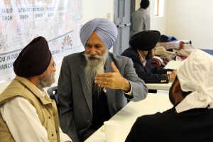 Members of the Sikh Temple of Wisconsin gather to eat and pray together